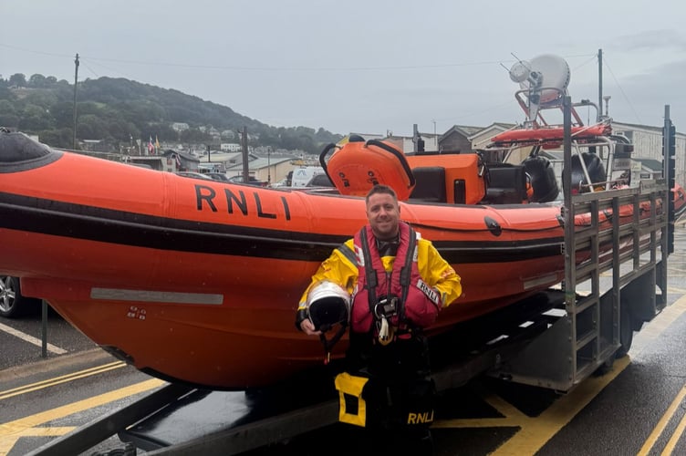 Teignmouth RNLI trainee crew member Lee Smith attended to a capsized sailing dinghy in his first shout at the weekend.