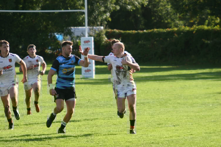 Two-time Newton try-scorer Josh Southworth delivers a hand-off 