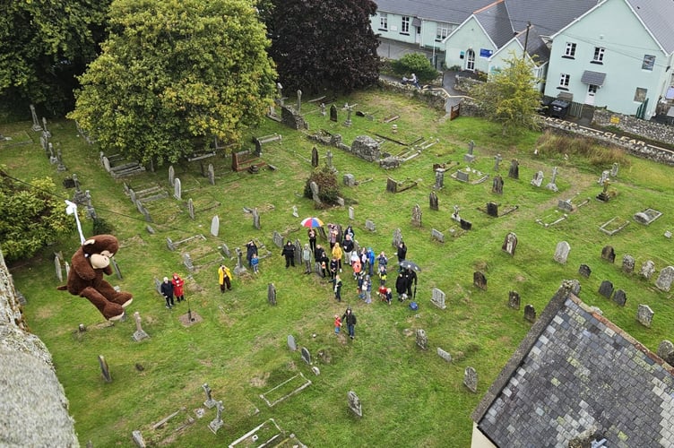 Monkey launches down the wire at Teddy Tower Day at St Michael's Church, Ilsington. 