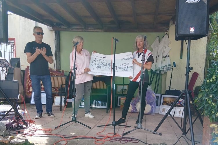 Dawlish BC making charity donation