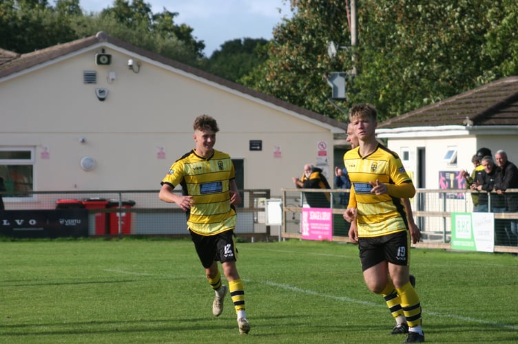 Buckland youngster Toby Hard wheels away in celebration