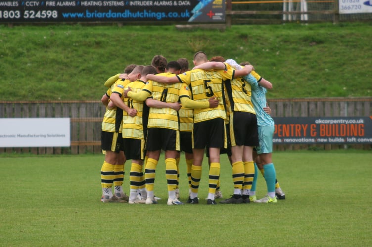 Buckland Athletic huddle vs Ilfracombe Town