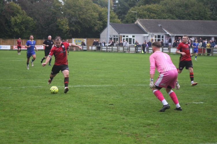Cieran Bridger through on goal for Bovey Tracey