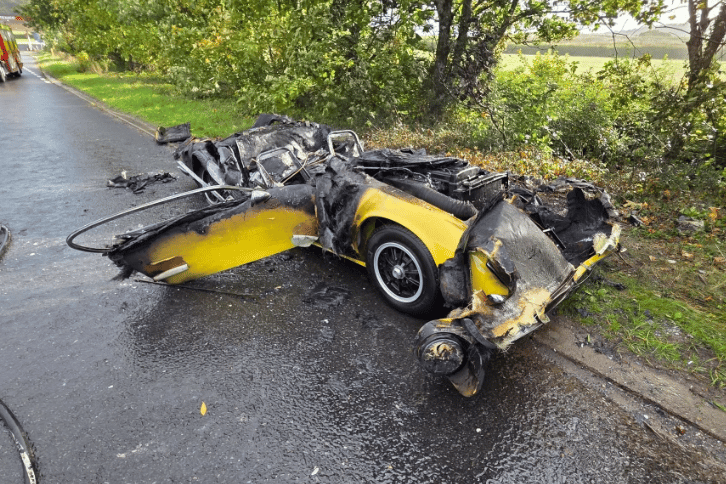 The car, thought to be a classic Lotus, was 'totally destroyed', the fire service said