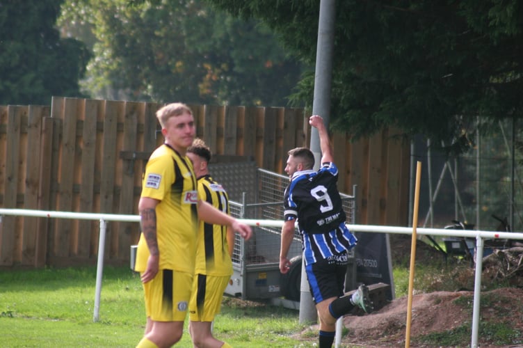 Spurs scorer Toby Pullman wheels away in celebration