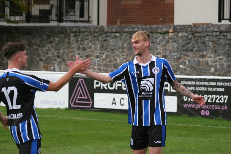 Chris Harvey celebrates scoring Spurs' third of the game