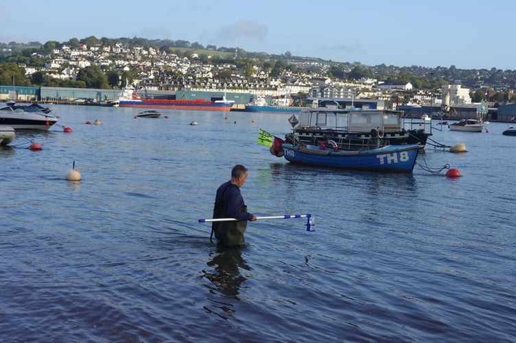 Stuart Reynolds from Friends of the River Teign (FORT) conducts water quality testing from Shaldon Beach.                               