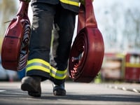 Firefighters rescue driver stuck in flood water
