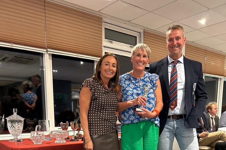 Teignmouth's ladies Champion of Champions 2025 Liz Tough, flanked by the captains