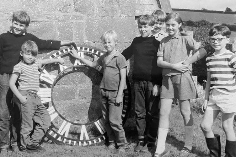 Youngsters from Ideford with the St Mary's Church tower's new clock dial before it was fixed in place in Ocotber 1970