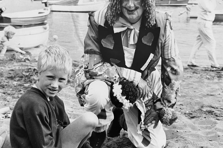 Shaldon Regatta Sandcastle competition from August 1987. Clown Hazel Prichards (also secretary of the Regatta committee) with eight year old Daniel Lowther from Shaldon
