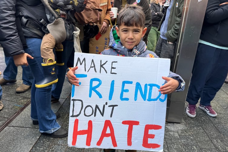 Make friends, don’t hate, was the message on one of the Exeter is for Everyone placards.  AQ 6322
