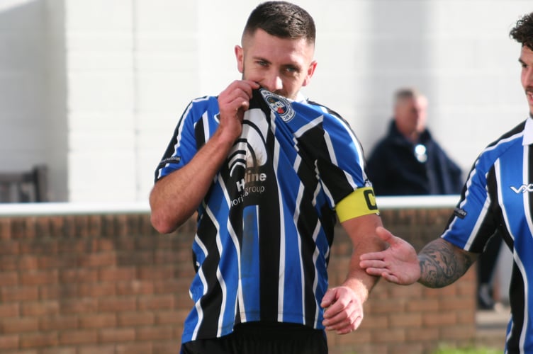 Toby Pullman kisses the Newton Spurs badge