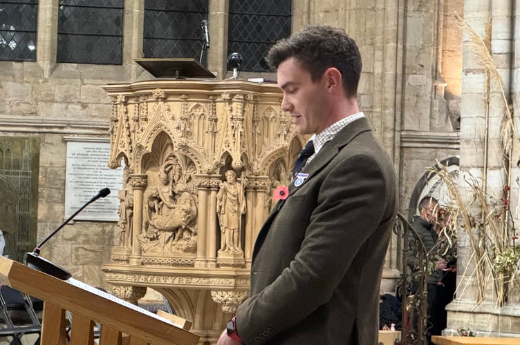 Harry Sprague, Junior Vice-Chairman, Devon YFC, reading the Prayers of Penitence during the Harvest Service.  AQ 6653