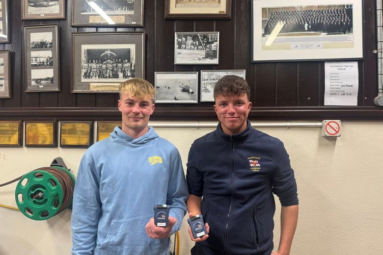Will Annal and Will Burton Jnr receive their RNLI pagers so they can respond to lifeboat shouts