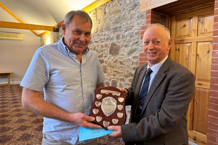 Norman Bulled won the Devon Classic Ploughing trophy, presented by President Raymond Govier.  AQ 7127
