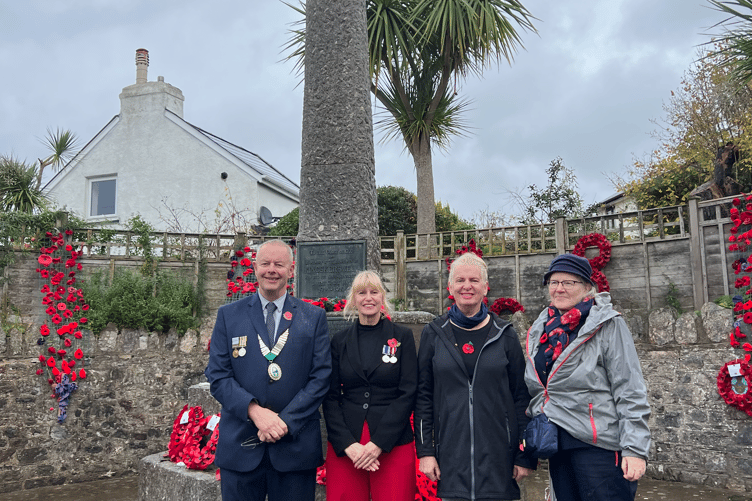 Councillors in Kingskerswell at the village's war memorial for Remembrance Sunday 2025