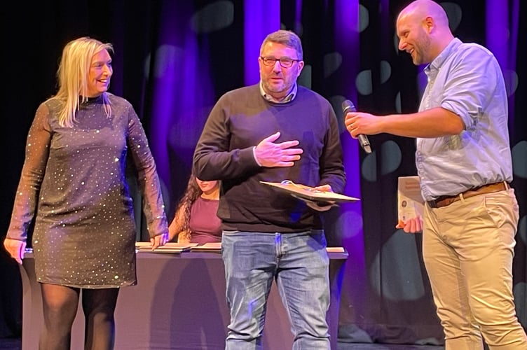 Pete Barbour from Teignmouth Football Club picks up a Stars of Teignbridge 2025 award for awareness and appreciation.