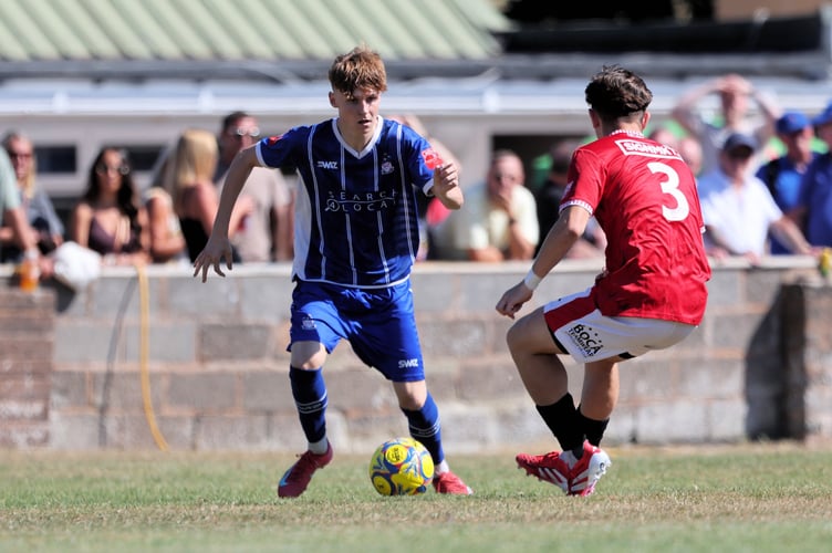Isaac McCue in action for Exmouth Town