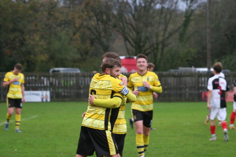 Ben Carter and Jack Baxter embrace after Buckland take the lead