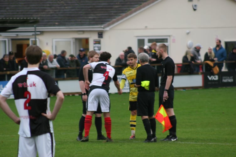 Buckland's Ben Carter shakes the hand of the Mallet captain
