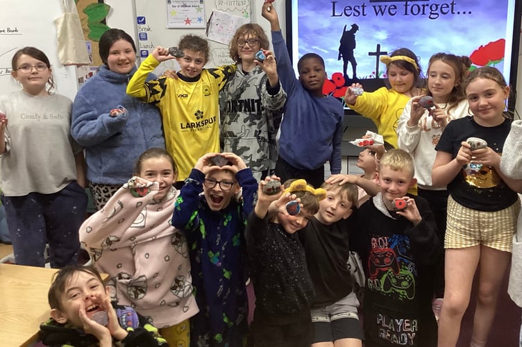 Pupils from St Joseph's in Newton Abbot with their decorated Remembrance stones.
