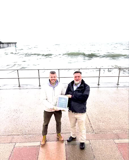 Ashley Webber, director at Balanced Energy (left) presents Roger Full, commercial director at TMS (right), with carbon neutral certification for scope 1 and 2