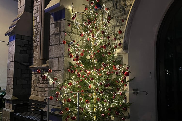 At night the Memorial Christmas tree shines brightly in the darkness.
