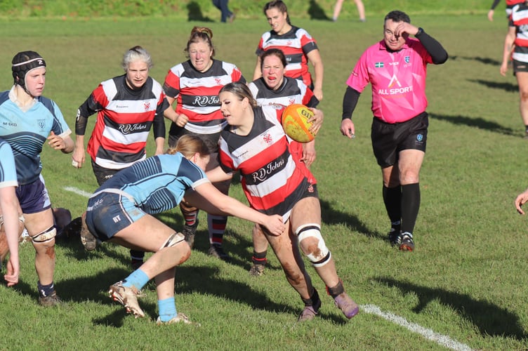 Jacqueline Mclellen bursting through the defence to score the 3rd try