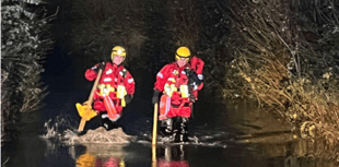 Fire crew's safety plea as two rescued from car stuck in flood water