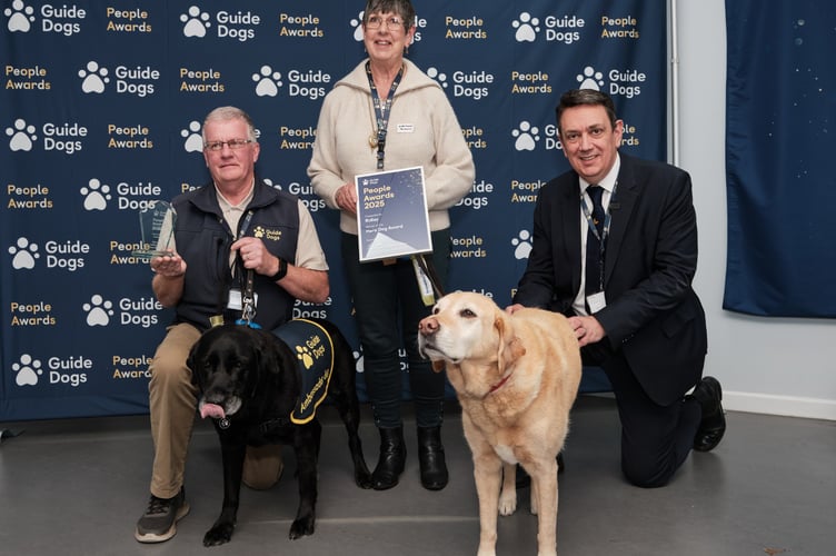 At the Guide Dogs award presentation left to right Peter Boston, Ridley, Marylou Boston, Clara and Andrew Lennox. Photo Guide Dogs 