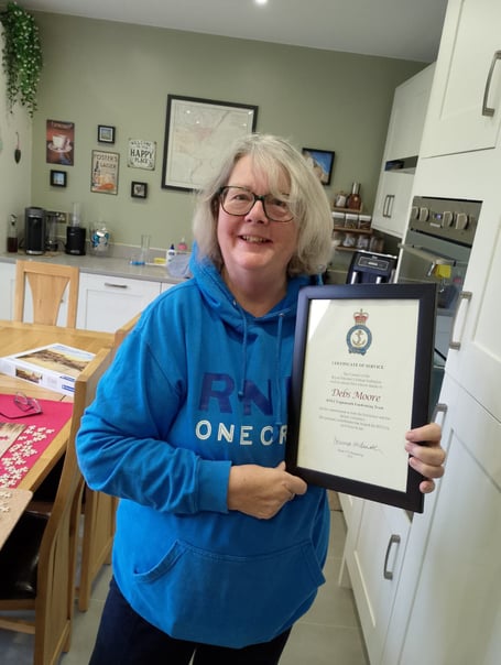 Debs Moore was presented with a certificate of service after stepping down from her role as fundraising treasurer for Teignmouth RNLI