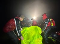 Rescuers battle wind and rain to help injured walker