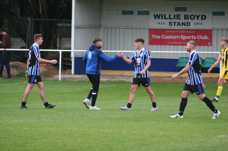 Spurs manager Connor Marshall (left) after beating Crediton at home