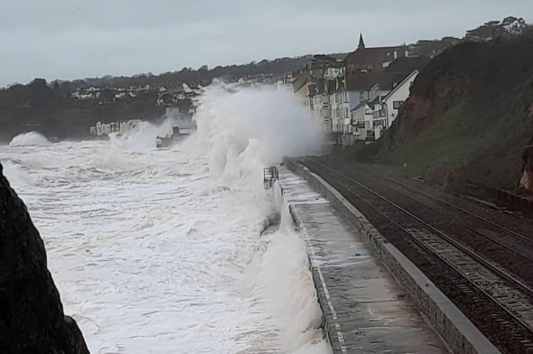 Renewed calls have been made for improvements to rail links to the SW after Storm Ingrid damage. Photograph of waves overwhelming the railway at Dawlish, by Tom Shiner-McGinley.