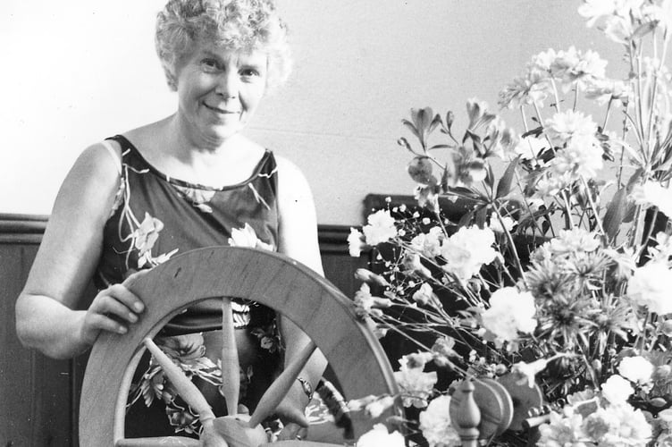 Dawlish Flower Group's show from May 1989. Hazel Drake and spinning wheel