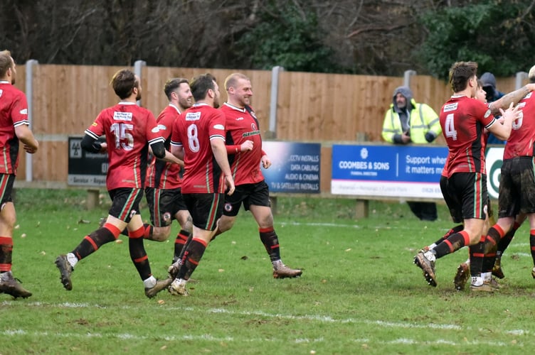 Bovey Tracey AFC celebrate their shootout victory over Liskeard
