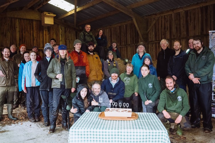 Group with celebration cake for 200,000th tree planted for Moor Trees © Josh Greet.jpg