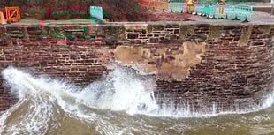 Fencing on sea wall while repair work continues 
