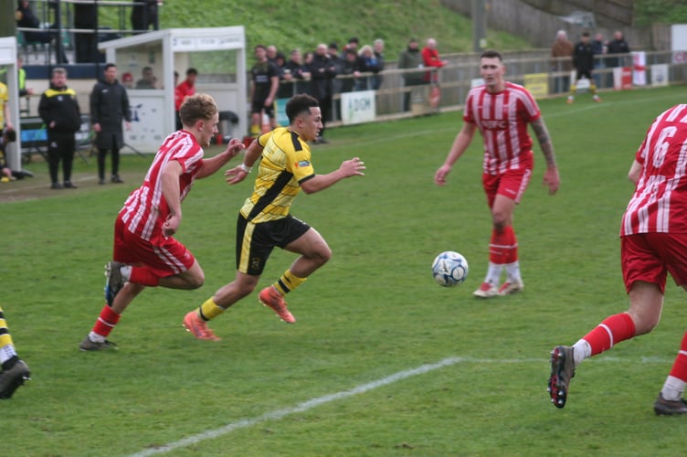 Phil Mendonca driving inside against Bridgwater