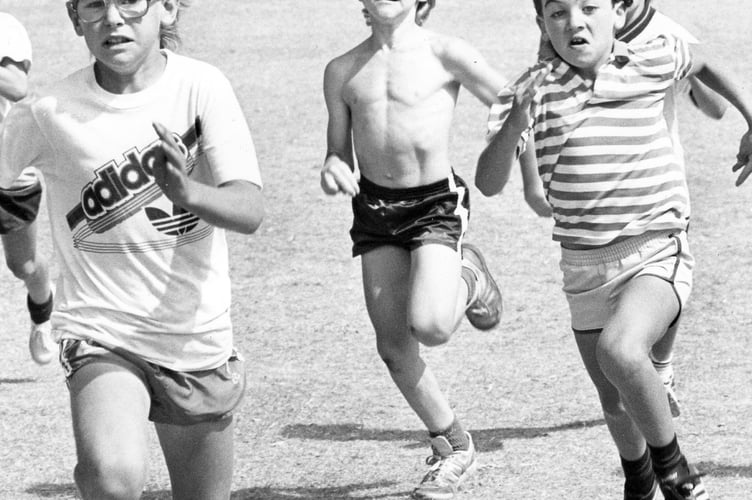 Mark Baker (on left) the winner of the 8-9 years boys' 50 yards dash at Dawlish Carnival Sports from August 1987
