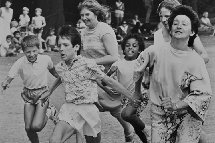 Dawlish Carnival from August 1987 . Sue Payne and son Lee lead the field in the mother and child 50 yard dash