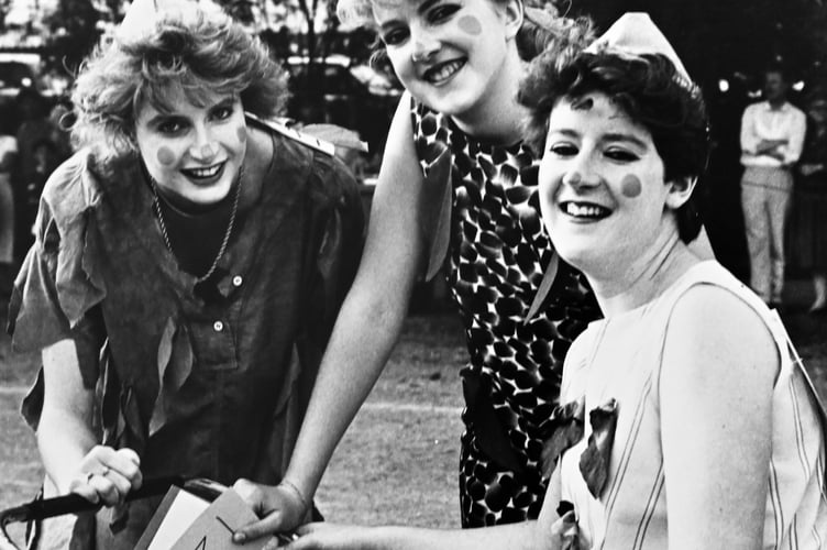 Dawlish Carnival from August 1987 . Helen McCallister, Sam Boutle and Lara Strong were the Pie-Eyed Pixies in the Pram Race