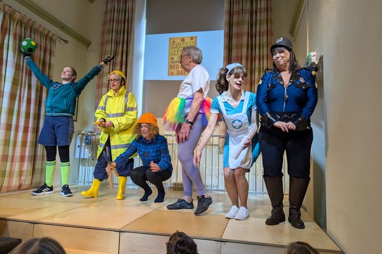 Cast members  of Trusham's The Revel on stage