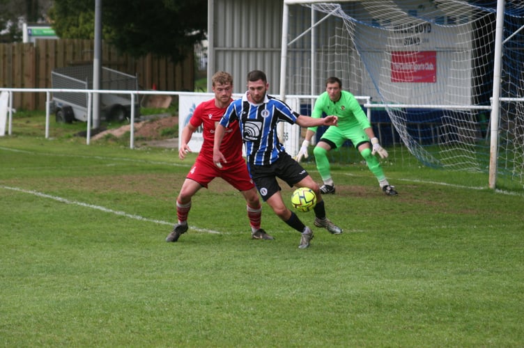 Spurs scorer Toby Pullman on the ball against Teignmouth