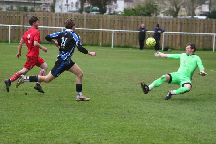 Callum Noyce sees his shot expertly saved.
