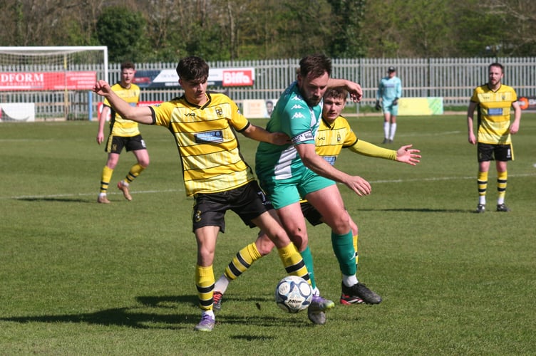 Buckland midfielder Tom Amado in possession against Helston