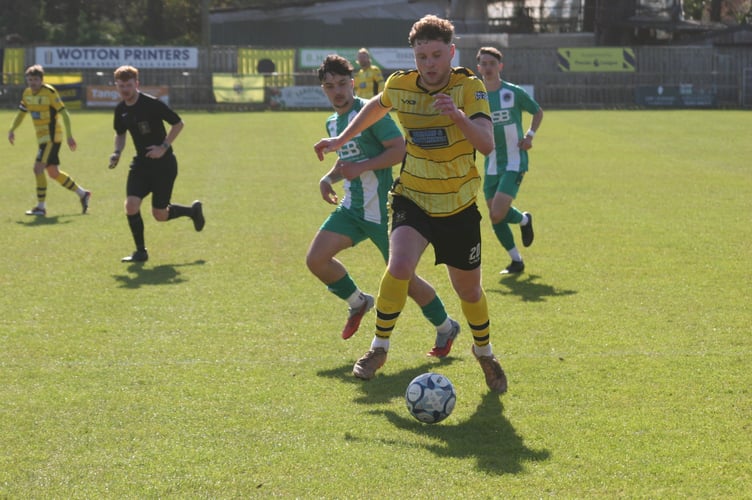 Jamie Simmonds drives through for Buckland.