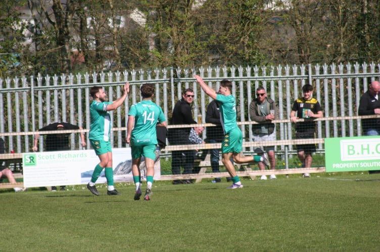 Helston celebrate their opener against Buckland