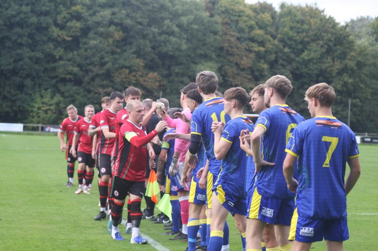 Bovey Tracey AFC handshakes vs Okehampton Argyle.
